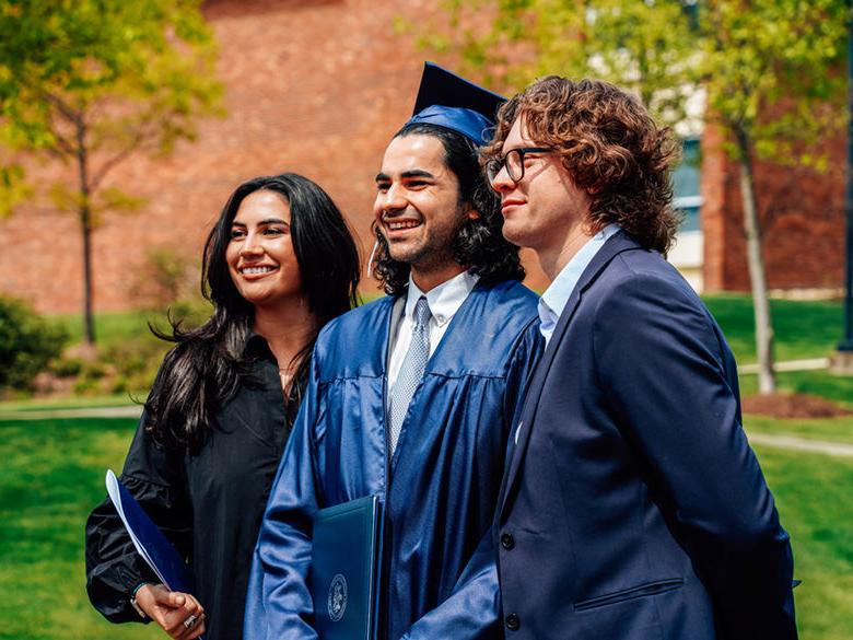 Photo of a graduate with his family